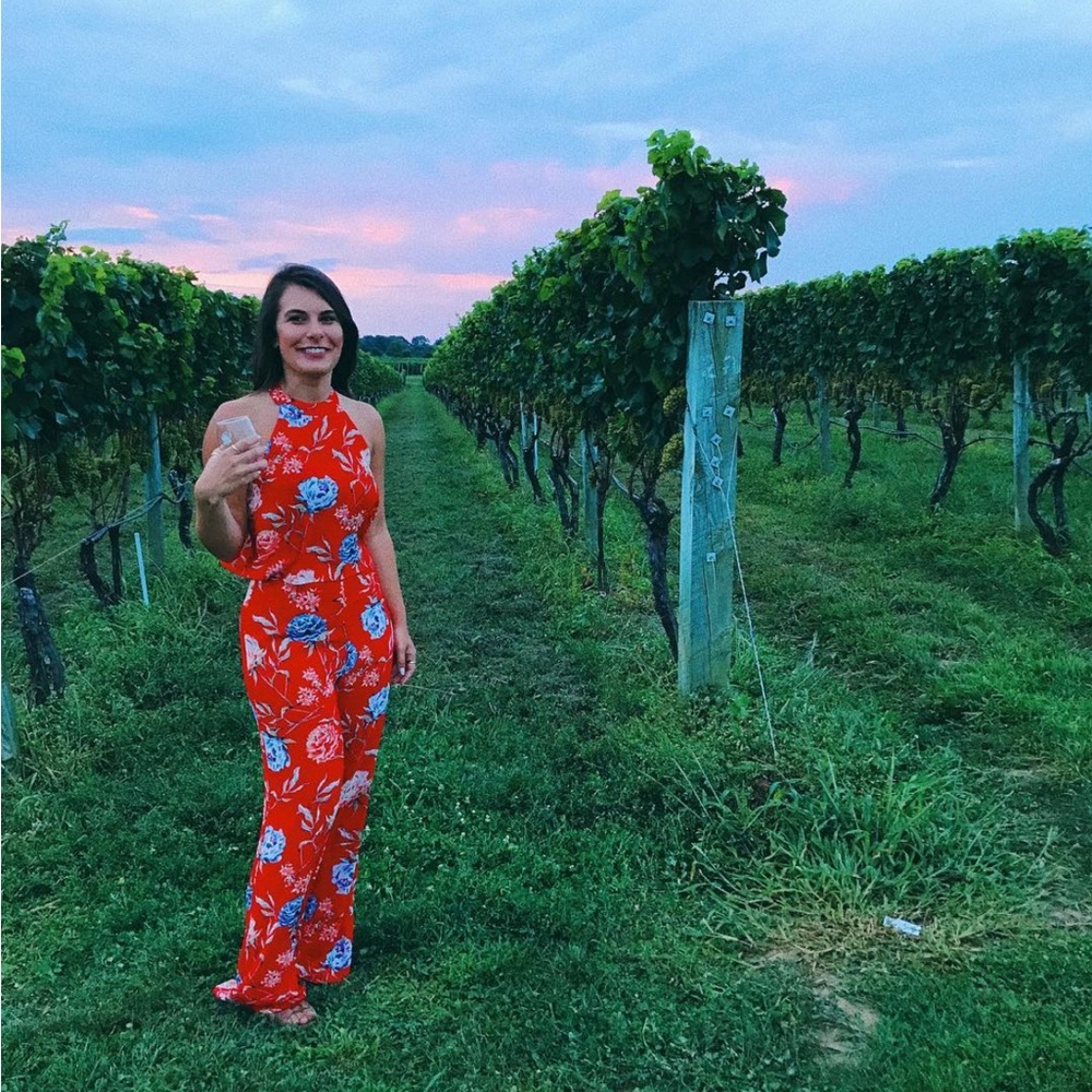 Floral jumpsuit with high neck and open back detail